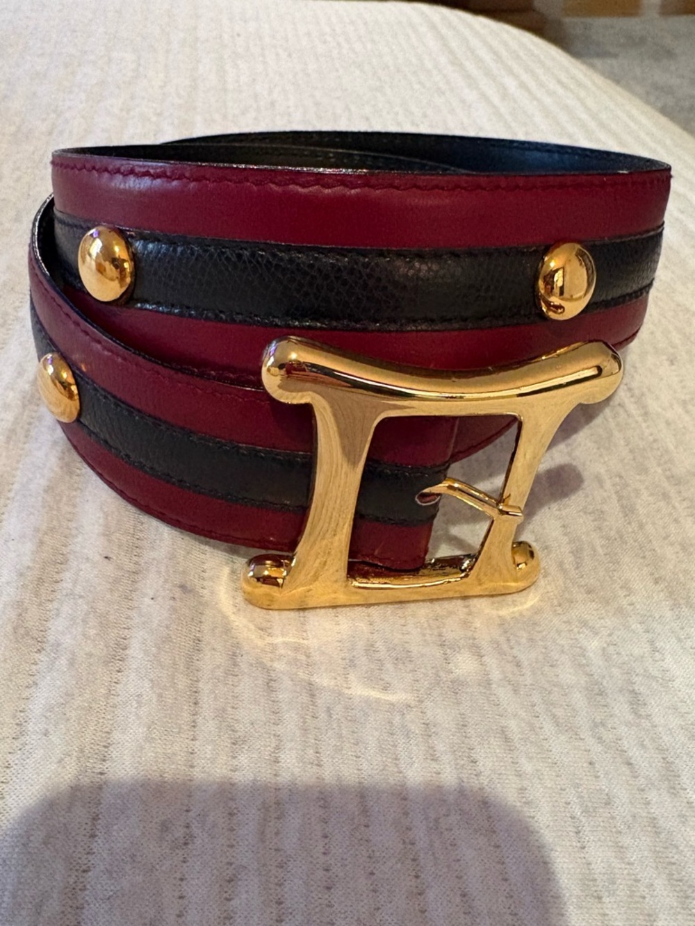 Burgundy and black ESCADA belt.